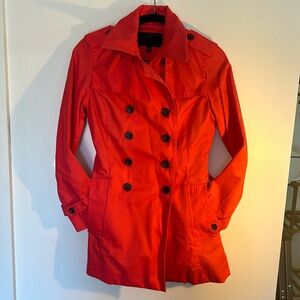 Bright coral trench coat perfectly fitted with large pockets